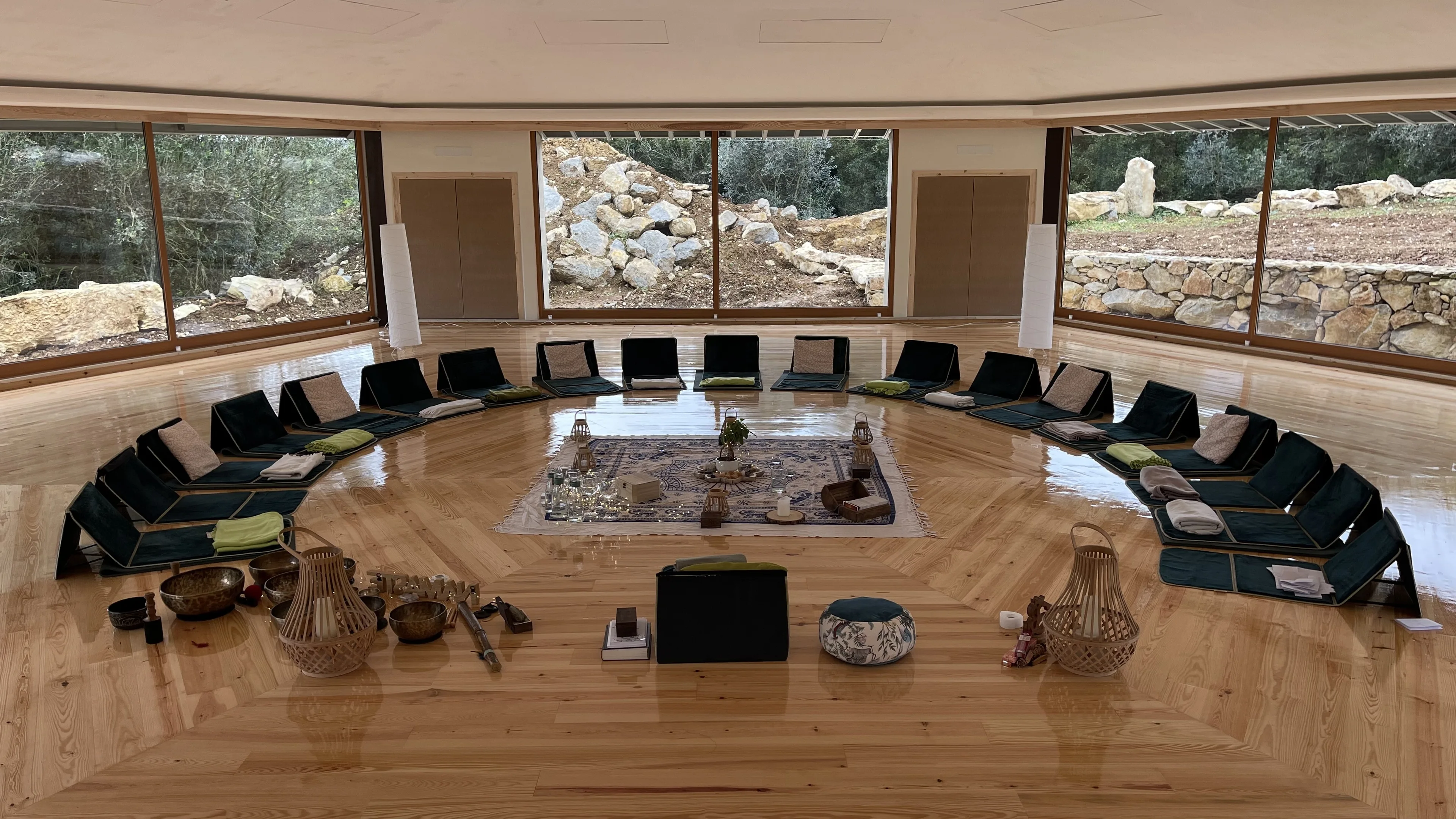 the retreat's circular working room, cushions and singing bowls
